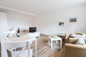 TV a/nebo společenská místnost v ubytování Ferienapartment Fuchsfarm