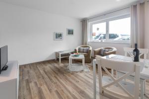 TV a/nebo společenská místnost v ubytování Ferienapartment Fuchsfarm