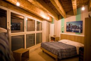 Posteľ alebo postele v izbe v ubytovaní Hotel Laghetto