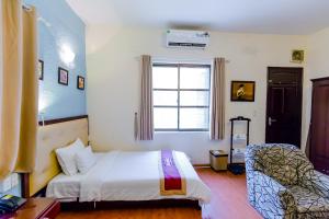 Giường trong phòng chung tại A25 Hotel - Hoàng Quốc Việt