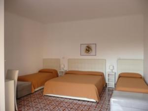 Postel nebo postele na pokoji v ubytování Garden House Ercolano
