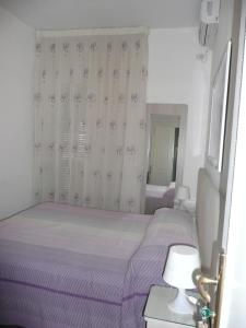 Postel nebo postele na pokoji v ubytování I Papiri B&B Aparthotel