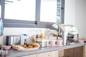 a kitchen counter with a bunch of food on it at Madison Boutique, Faliraki in Faliraki