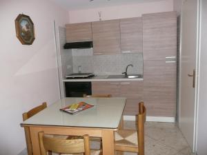 Kuchyň nebo kuchyňský kout v ubytování I Papiri B&B Aparthotel