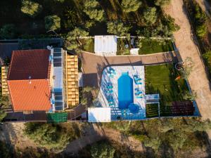 an overhead view of a building with a swimming pool at Studios Gagos in Astris