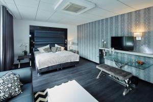Postel nebo postele na pokoji v ubytování Kurhaus Design Boutique Hotel