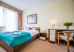 Ένα ή περισσότερα κρεβάτια σε δωμάτιο στο Senlux Apartments +9 φωτογραφίες