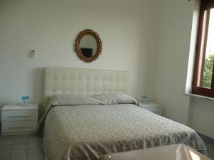 Postel nebo postele na pokoji v ubytování Garden House Ercolano