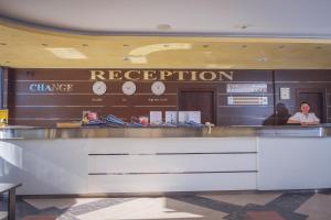 a reception counter in a hotel lobby with a dispatcher at Hotel Rеgina - Golden Sands All Inclusive in Golden Sands +34 photos