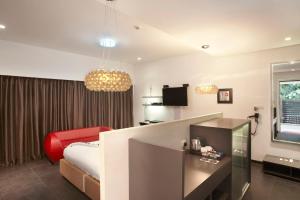 Кровать или кровати в номере Fahrenheit Hotels & Resorts