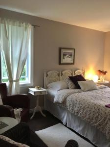 Postel nebo postele na pokoji v ubytování Au Gré Du Temps - Gîte B&B