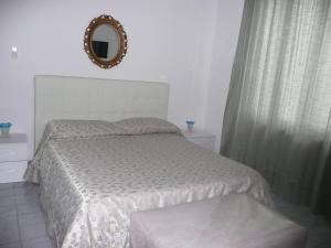 Postel nebo postele na pokoji v ubytování Garden House Ercolano