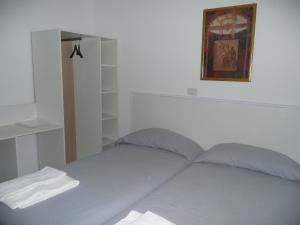 Postel nebo postele na pokoji v ubytování Garden House Ercolano