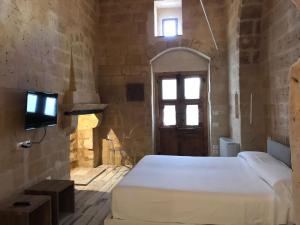 Postel nebo postele na pokoji v ubytování B&B Al Convento