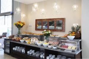 a breakfast buffet with food on a table at MR Hotel Providencia (ex Hotel Neruda) in Santiago