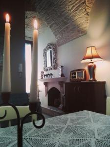 a bedroom with a bed and a fireplace and a mirror at GioVì B&B Room in Terlizzi