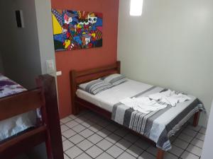Un pat sau paturi într-o cameră la Pousada Aconchego do Porto