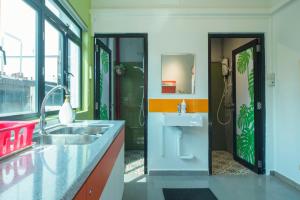 a bathroom with a sink and a toilet in it at RedDoorz Hostel at Kallang MRT in Singapore