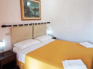 Postel nebo postele na pokoji v ubytování Casa Ulisse