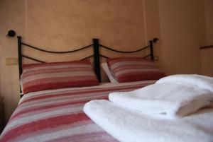 Postel nebo postele na pokoji v ubytování Hotel Iscla