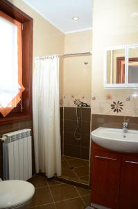 a bathroom with a shower and a sink at Къща за Гости Солакови ** in Devin