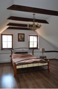 Ein Bett oder Betten in einem Zimmer der Unterkunft Pod Katedrą
