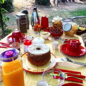 a table with a cake and other food on it at B&B Apricot in Policoro