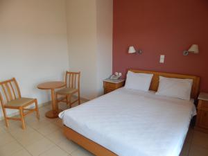 Voodi või voodid majutusasutuse Hotel Lykeon toas