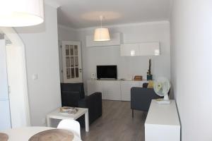 Uma TV ou centro de entretenimento em Vigia's Guest House