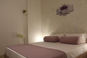 A bed or beds in a room at Souvenir d'été