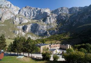 a large building in front of a mountain at Parador de Fuente Dé in Fuente Dé