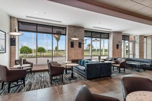 a lobby with couches and tables and windows at Hyatt Place Tampa/Wesley Chapel in Lutz +28 photos