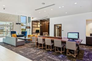 a dining room with a table and chairs at Hyatt Place Tampa/Wesley Chapel in Lutz