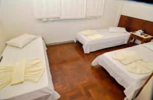 Postel nebo postele na pokoji v ubytování Hotel Indaiá
