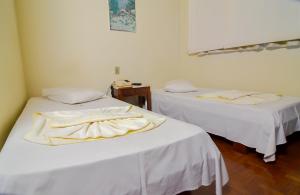 Postel nebo postele na pokoji v ubytování Hotel Indaiá