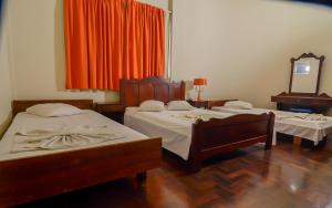 Postel nebo postele na pokoji v ubytování Hotel Indaiá
