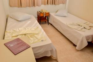 Postel nebo postele na pokoji v ubytování Hotel Indaiá