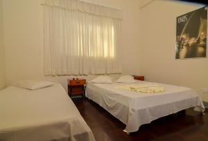 Postel nebo postele na pokoji v ubytování Hotel Indaiá