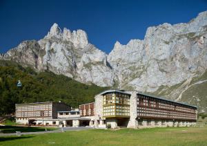 a large building in front of a mountain at Parador de Fuente Dé in Fuente Dé