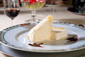 a piece of cake on a plate on a table at Parador de Fuente Dé in Fuente Dé