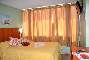 Letto o letti in una camera di Hostal Terra 1 - ANDALUCÍA