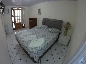 Postel nebo postele na pokoji v ubytování Morada do Aventureiro