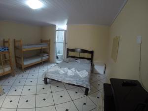 Postel nebo postele na pokoji v ubytování Morada do Aventureiro