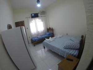 Postel nebo postele na pokoji v ubytování Morada do Aventureiro