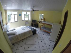 Postel nebo postele na pokoji v ubytování Morada do Aventureiro