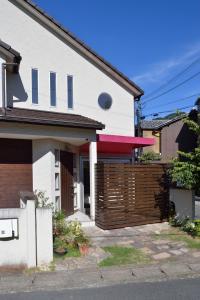 a house with a wooden fence in front of it at Kyoto - house / Vacation STAY 1099 in Kyoto +12 photos