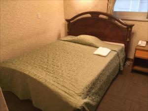 Katil atau katil-katil dalam bilik di Sunrise Kanko Hotel