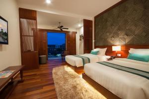 Voodi või voodid majutusasutuse Lotus Blanc Resort toas
