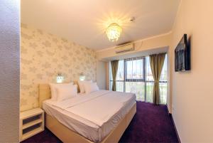 Postel nebo postele na pokoji v ubytování Philia Hotel + 37 fotografií
