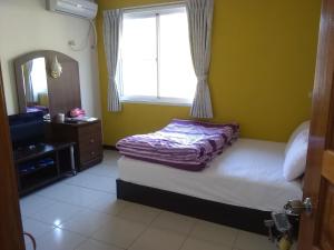 Una cama o camas en una habitación de 內灣星光流域民宿